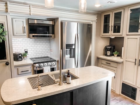 Residential Fridge, Microwave and Kitchen island.  