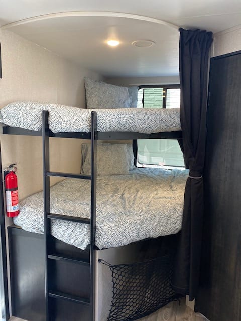 Both bunks include personal lights, two USB ports, two 110 outlets, brand new bedding and pillows, and opening/closing windows in each.
