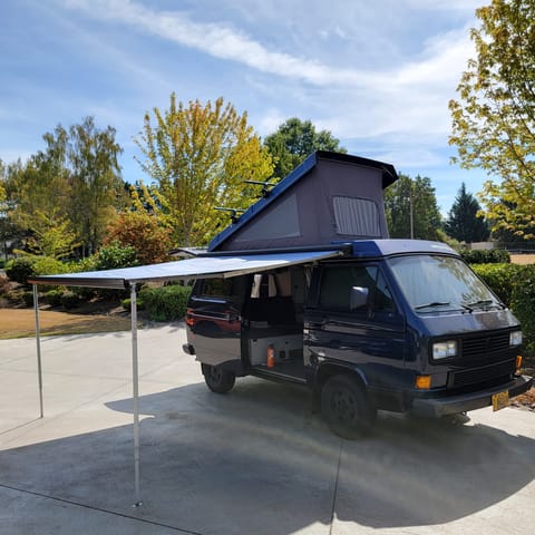 Fiamma 8ft Awning deployed for shade.