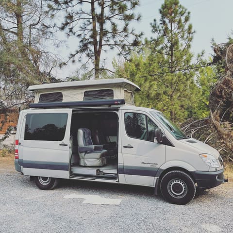 Side door gives easy access to dining and sleeping.  The low roof Sprinter makes it easy to park.  The penthouse pops up only when you need it. 