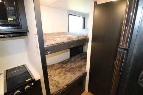Two bunks with a window and usb charging outlets. Perfect for kids!