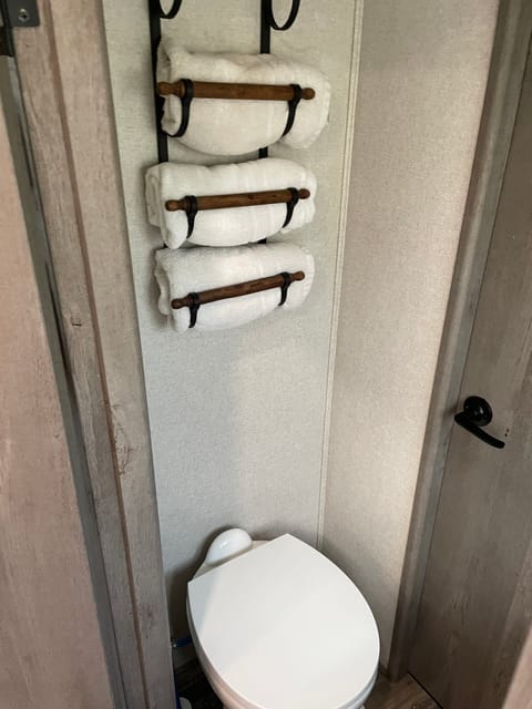 Hanging rack for extra towels. 