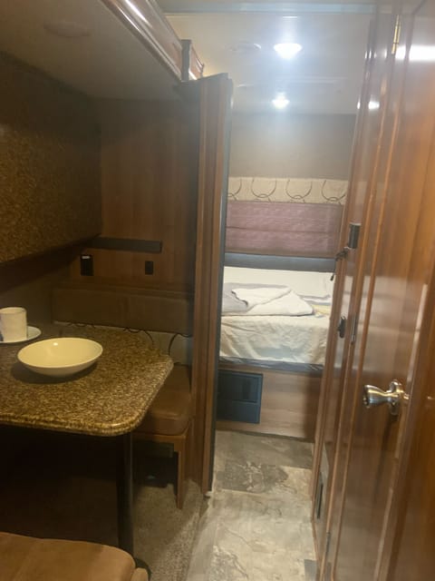 Small dining area in the rear of the motorhome that converts into two bunk beds