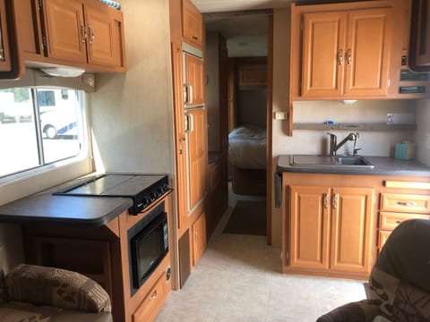 Here you'll see the kitchen and inside view looking towards the master bedroom. 