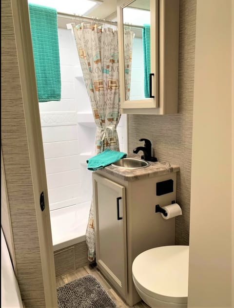 Spacious shower with skylight. Marine-grade toilet with foot flush. With its smart layout, clever storage solutions, and quality fixtures, it provides a nice private retreat.
