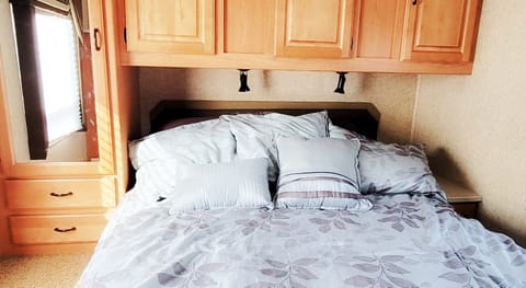 Queen bed with mattress topper