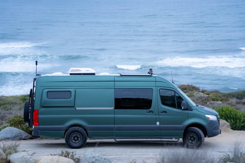 Side view of van at sunset cliffs 