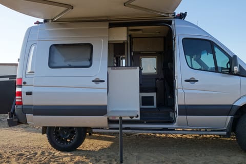 Exterior table is great for cooking with in the included extra gas burner.  Self supporting awning for sun protection.