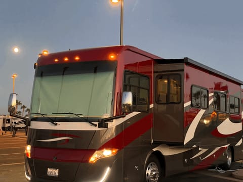 Exterior view of coach at dusk.