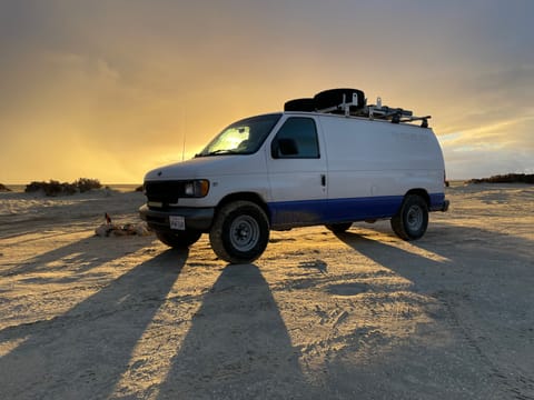 Meet Daisy Mae! Our adventure camper van extraordinaire! The tires won't be on the roof when you rent her, but sunsets look just about the same :)