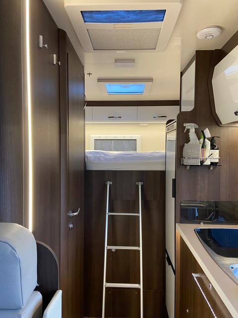 Fixed double at the rear of the motorhome, lots of storage space