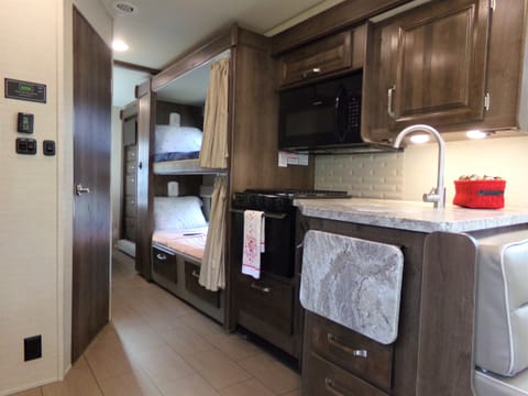 This RV has a full-size kitchen with gas range, oven and a huge fridge to store plenty of food for your trip.  We include the ingredients for smores!
