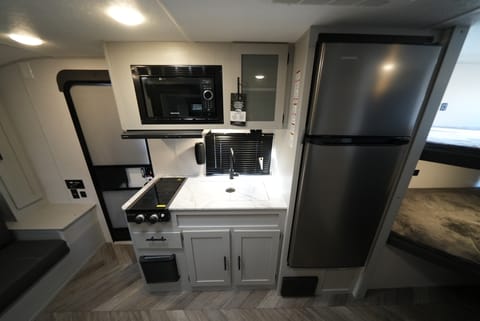 Kitchen : fridge, microwave, stove, sink