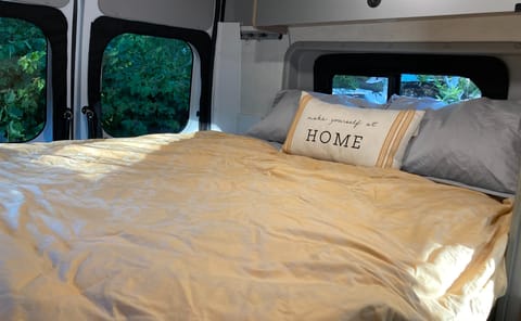 This is the primary bed in the rear of the van. It's queen size and comfy. It also fold up to allow for more storage or living space.