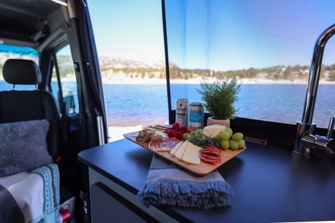 Have lunch on the road with a stocked kitchen with fridge.