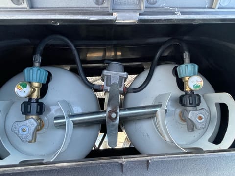 two 30 pound propane tanks with Guage