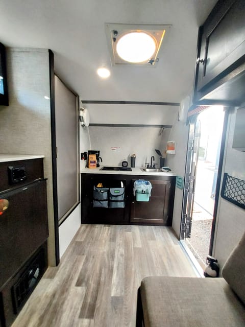 Camper offers minimalistic open floor with all amenities within arm's reach.