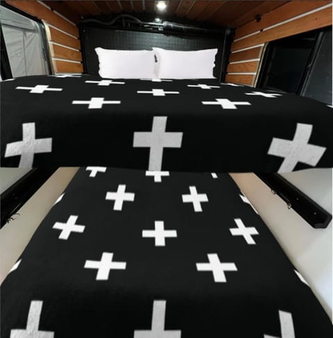 Bedding - two larger than 2 queen sized beds. Blankets and pillows not included. Camping in style.