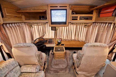 -Pilot & co-pilot area
-so comfortable and best view in the house
(Photo taken from sales brochure)
The tv is out of the RV - who needs it lol!