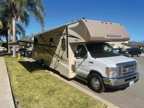 This RV comes equipped with a huge awning with LED lights to shield you from the sun and light up your campsite. 