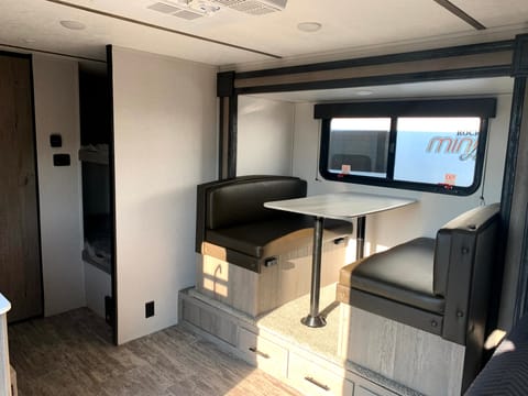 Slide out dining for more room. Storage under each bench seat.