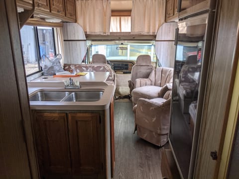 Also shows fridge across from stove with more storage underneath it.