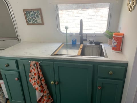 Large counter space for preparing food. Ample storage in cabinets below.