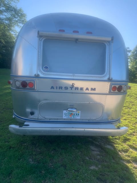 Back of the Airstream hoses and hookups store in bumper.