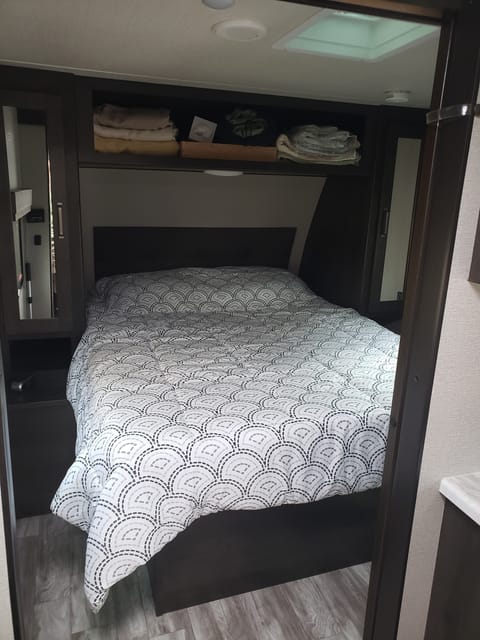 Very comfortable queen-size bed with over-head storage. Wardrobes on each side. 