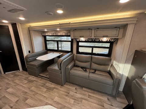 The dinette and sofa convert to small beds.