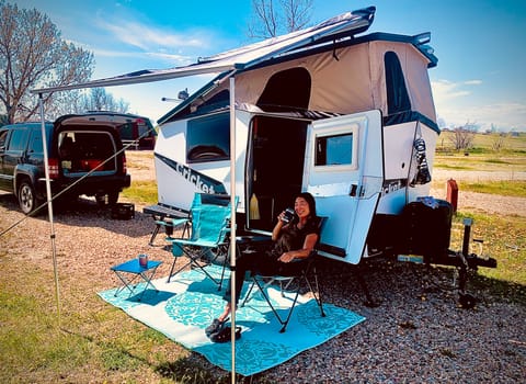 Shown with Thule awning and camp furniture set. 