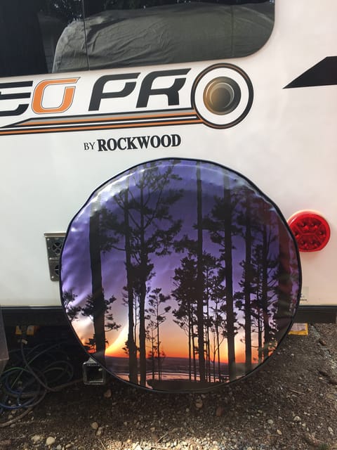 This spare tire cover is a picture I took of the Pacific Beach at sunset.