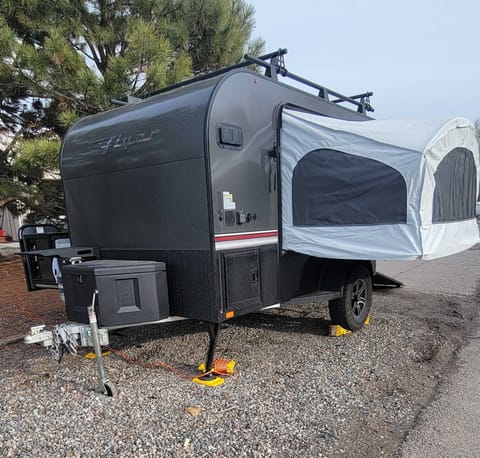 Travel trailer with bed out and ready to camp