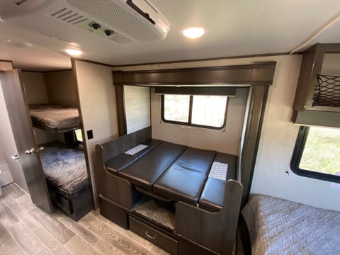 Perfect setup for 5-6 people. Bunks, convertible dining table, and Queen size bed. You have your fun all day and sleep easy all night. 