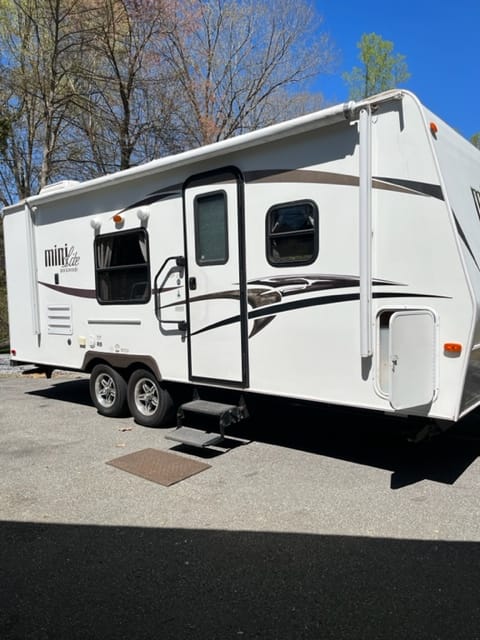 Forest River Mini Lite 23" from hitch to bumper sleeps 6 has large awning is ready to make fun memories