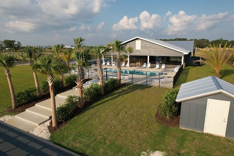 View of the awesome clubhouse with a mini-kitchen, bath house, and full laundry facilities. Pool #1