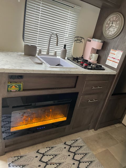 romantic fireplace, kitchen area with keurig machine
