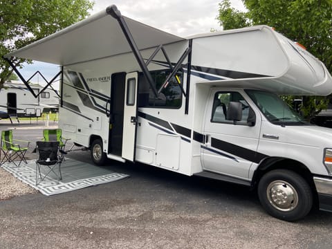 Motorized awning w/led lights, outdoor rug and chairs included