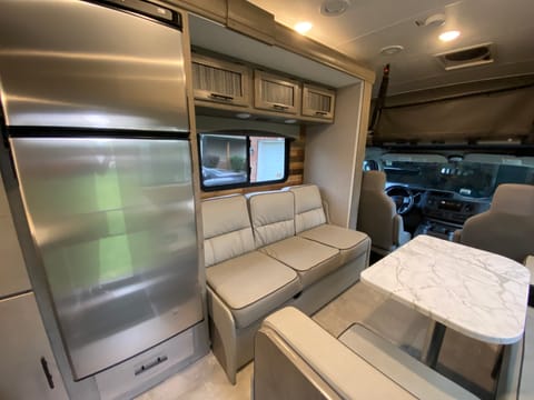 Seating for 5 in cabin while driving - 3 on sofa and 2 around table.