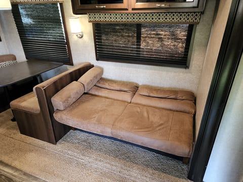 Leather sofa fold out into a twin bed.