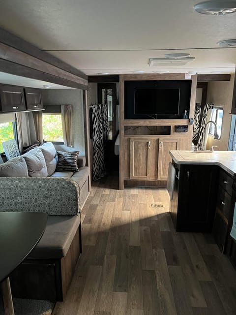 This photo is taken from the bunkhouse looking into dining, kitchen and living area