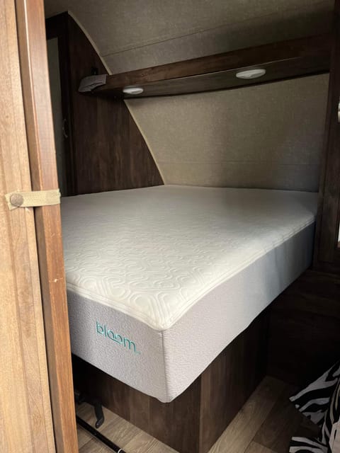 This is a photo of the queen master bedroom. Doors close on each end. Upgraded mattress to a bloom full queen (not a trailer queen) 