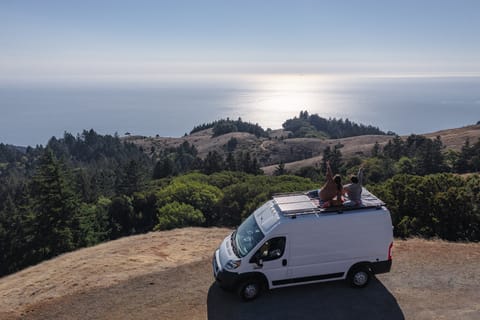 Embrace the serenity of coastal bliss as our camper van provides a front-row seat to breathtaking ocean views with our rooftop deck.