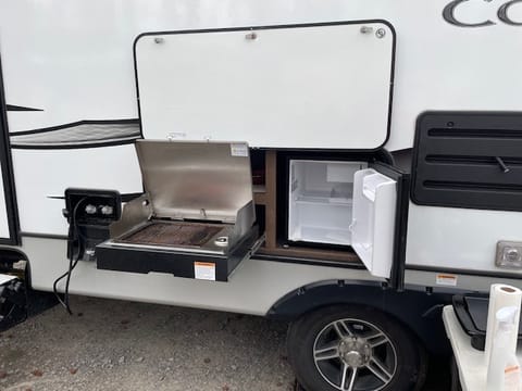 Don't want to cook inside.... Outdoor grill with mini fridge! 