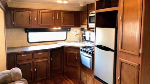 Lots of storage, full size pantry, three burner stove and microwave 