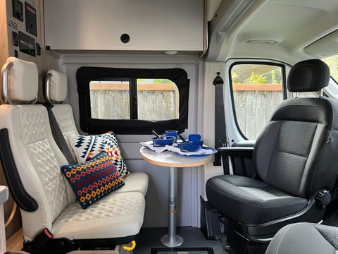 Front seats swivel backwards for a family meal with Coleman dishes and cups for up to eight people. 