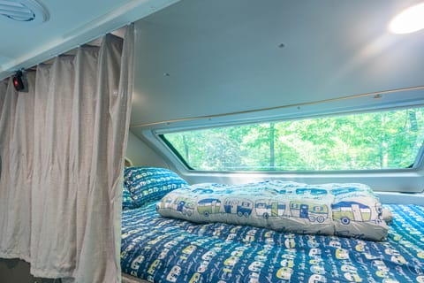 The overhang loft has a privacy curtain.