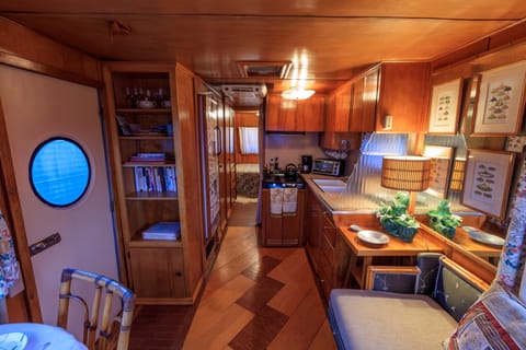 Interior of our PARKED 1954 Spartan Manor "Gypsy" Galley on right, refrigerator on left, hallway to bath and sleeping canin.