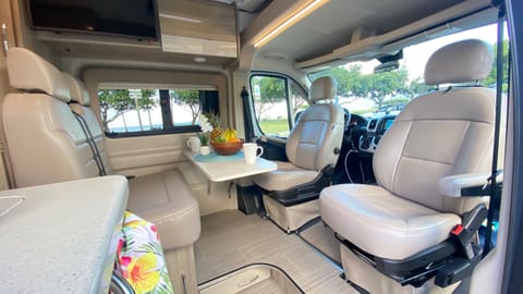 Rotating captains chairs, fold out table for meals or games. Included in the van are our favorite games, Catan travel version and Farkle! 