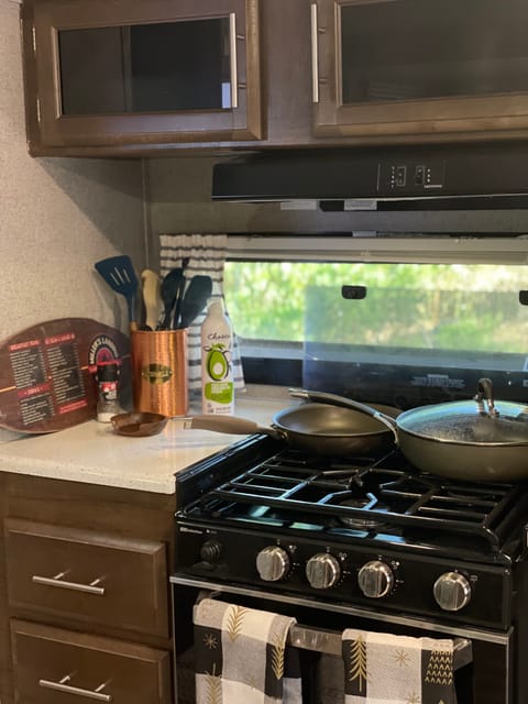 Stocked kitchen with propane range/oven. 